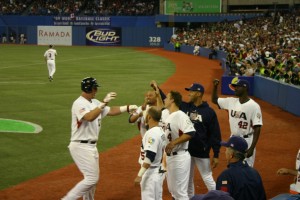 Dunn congratulated after his home run. Where is his hug?