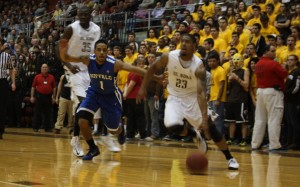 Chris Johnson drives to the hoop for two of his 14 points against Buffalo - Photo by Daulton Sherwin