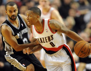  Damian Lillard (0) dribbles the ball past San Antonio Spurs point guard Tony Parker (9) during the fourth quarter of the game at the Rose Garden. Lillard scored 29 points as the Blazers won the game 98-90. (Steve Dykes-USA TODAY Sports)