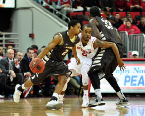St. Bonaventure Bonnies guard Eric Mosley (2) dribbles as North Carolina State Wolfpack guard Lorenzo Brown (2) fights through a ball screen by St. Bonaventure Bonnies forward Marquise Simmons (33) during the first half at PNC Arena.  (Photo by Rob Kinnan-USA TODAY Sports)