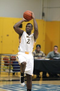 Zimmerman (21) attacking the basket earlier this season. Photo courtesy of Courtesy of Monroe Community College Athletics/Jamie Germano