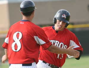 Wellsville's Shane Barley, right, is congratulated by head coach Anthony Barone (8) after hitting his second home run of Wednesday's win over the Olean Oilers. (PAUL A. JANNACE/Wellsville Daily Reporter)