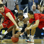 Davis (right) and teammate Bobby Wehrli battle Kris Dunn for a loose ball. (Photo by Greg Bartram-USA TODAY Sports)