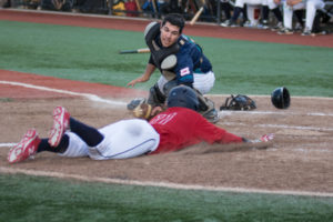 Shane Soria is safe at home as Rochester sweep Wellsville in NYCBL action at Basket Road Field. (Photo by SUE KANE @skane51)