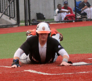 Outlaw first baseman Zack Blonder slides home with the sixth and final score in the top of the third against the Salt Cats to go up by 5.  (Photo by BRIAN HOREY a/k/aBRIANthePHOTOguy)