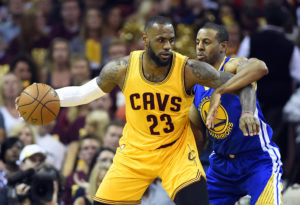 LeBron James (23) handles the ball against Golden State Warriors guard Andre Iguodala (9) during the second quarter in game four of the NBA Finals at Quicken Loans Arena. (Photo: Bob Donnan-USA TODAY Sports)