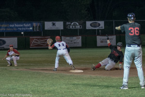 Bubba Hollins waits at the third base bag for the throw to get Andy Lalonde. (Photo by SUE KANE @skane51)