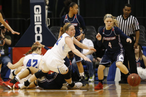 Saint Louis Billikens forward Olivia Jakubicek (12) and Duquesne Lady Dukes guard Chassidy Omogrosso (4) chase a loose ball in the second quarter in the women's Atlantic 10 Conference tournament at Richmond Coliseum. The Lady Dukes won 56-52. (Photo: Geoff Burke-USA TODAY Sports)