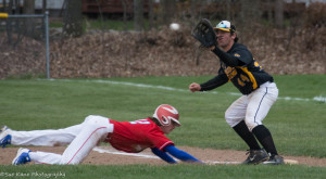 Fairport's Jeff Pratt dives in safely at first as Athena's Justin LoTemple covers the bag. (Photo: SUE KANE)