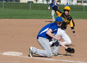 McQuaid's Nick Tomei slides in safely ahead of the tag at third by Bishop Kearney's Ian Pawluckie. (Photo by SUE KANE)