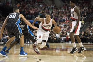 Portland Trail Blazers guard CJ McCollum (3) drives to the basket against Orlando Magic forward Aaron Gordon (00) at Moda Center at the Rose Quarter. (Photo: Troy Wayrynen-USA TODAY Sports)