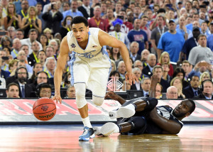 Marcus Paige (5) gets past Daniel Ochefu (23) to tie the score with 4.7 seconds remaining. (Photo: Robert Deutsch-USA TODAY Sports)