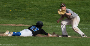 Batavia's Jerry Reinhardt slides back in safely ahead of the tag at first by Greece Arcadia's Kyle Bailey. Greece Arcadia defeated Batavia 13-0. (Photo: SUE KANE)