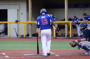 Isaac Holt (Nebraska Omaha) at the plate for the Rapids.