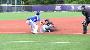 Matt Schneider (Mercyhurst) slides in before the tag before scoring the first run for the Oilers.