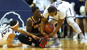 Monmouth Hawks guard Justin Robinson (12) and guard Austin Tilghman (23) battle Iona Gaels guard A.J. English (5) for a loose ball during the second half at Multipurpose Activity Center.The Iona Gaels defeated the Monmouth Hawks 83-67. (Photo: Noah K. Murray-USA TODAY Sports)