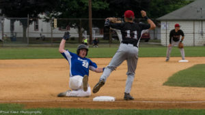 Hornell's Tanner Klein (26) slides in safe at third. Olean's David Hollins (11) waits for the throw. (Photo: SUE KANE)