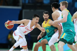 Rio de Janeiro, Brazil; China guard Ailun Guo (6) dribbles the ball around Australia shooting guard Kevin Lisch (11) during the men's team preliminary in the Rio 2016 Summer Olympic Games at Carioca Arena 1. (Photo: Jason Getz-USA TODAY Sports)
