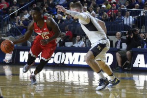 Ohio State Buckeyes guard Kam Williams (15) looks drives to the basket as Navy Midshipmen guard Nourse Fox (0) defense during the first half at Alumni Hall. (Photo: Tommy Gilligan-USA TODAY Sports)