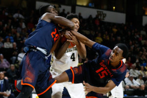Wake Forest Demon Deacons center Doral Moore (4) fights for a ball with Bucknell Bison guard Nate Jones (15) and center Nana Foulland (20) in the first half at Lawrence Joel Veterans Memorial Coliseum. (Photo: Jeremy Brevard-USA TODAY Sports)