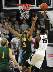 Former Greece Athena Trojan and current Vermont Catamount Anthony Lamb (3) challenges a shot from fellow Section V and City Rocks alum Emmitt Holt (15). Lamb and Holt met Monday night when Providence defeated Vermont. Holt played for Webster Schroeder during his high school career. (Photo: Bob DeChiara-USA TODAY Sports)