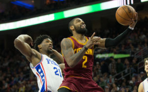 Kyrie Irving (2) gets to the basket past Philadelphia 76ers center Joel Embiid (21) during the fourth quarter at Wells Fargo Center. (Photo: Bill Streicher-USA TODAY Sports)