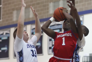 Rayshawn Boswell (1) netted 12 of his team-high 24 points in the fourth stanza, and Monroe rallied to defeat the World of Inquiry Griffins, 80-74 in RCAC action Wednesday night. (Photo: Ron Kalasinskas)