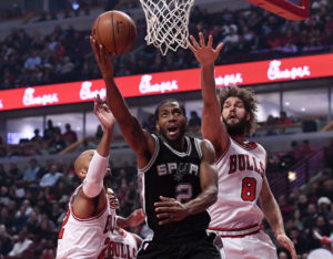 San Antonio Spurs forward Kawhi Leonard (2) goes to the basket between Chicago Bulls forward Taj Gibson (22) and center Robin Lopez (8) during the first half at the United Center. (Photo: Mike DiNovo-USA TODAY Sports)