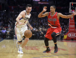 Los Angeles Clippers guard J.J. Redick (4) moves the ball against Portland Trail Blazers guard C.J. McCollum (3) during the second half at Staples Center. (photo: Gary A. Vasquez-USA TODAY Sports)