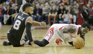 Houston Rockets guard Patrick Beverley (2) grabs a loose ball against San Antonio Spurs guard Patty Mills (8) in the second quarter at Toyota Center. (Photo: Thomas B. Shea-USA TODAY Sports)