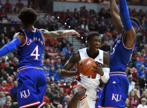 UNLV Runnin' Rebels guard Zion Morgan (10) fights for position with Kansas Jayhawks forward Carlton Bragg (15). Kansas won the game 71-53. (Photo: Stephen R. Sylvanie-USA TODAY Sports)