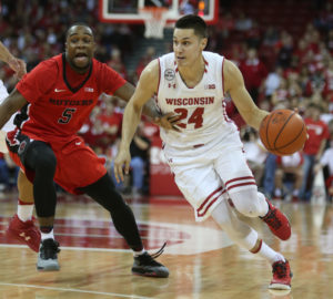 Wisconsin Badgers guard Bronson Koenig (24) takes the ball up the floor as Rutgers Scarlet Knights guard Mike Williams (5) follows at the Kohl Center. Wisconsin defeated Rutgers 72-52. (Photo: Mary Langenfeld-USA TODAY Sports)