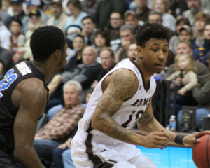 Adams (10) finished the game hitting 9-of-15 from the floor including 5-of-9 behind the arc and scored 11 of his game-high 29 points in the final 5:51. Dontay Caruthers (East High) defends on the play. (Photo courtesy of St. Bonaventure athletics). 