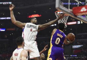  Nick Young (0) shoots against DeAndre Jordan (6) in the first half during the NBA game at the Staples Center. (Photo: Richard Mackson-USA TODAY Sports)