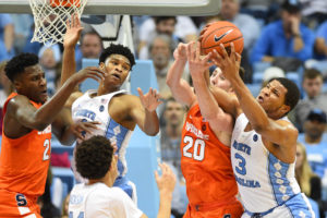 Syracuse Orange forwards Tyler Roberson (21) and Tyler Lydon (20) and North Carolina Tar Heels forwards Isaiah Hicks (4) and Kennedy Meeks (3) fight for the ball in the first half at Dean E. Smith Center. (Photo: Bob Donnan-USA TODAY Sports)