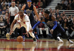 Dwyane Wade (3) and Wesley Matthews (23) battle for a loose ball. (Photo: Caylor Arnold-USA TODAY Sports)