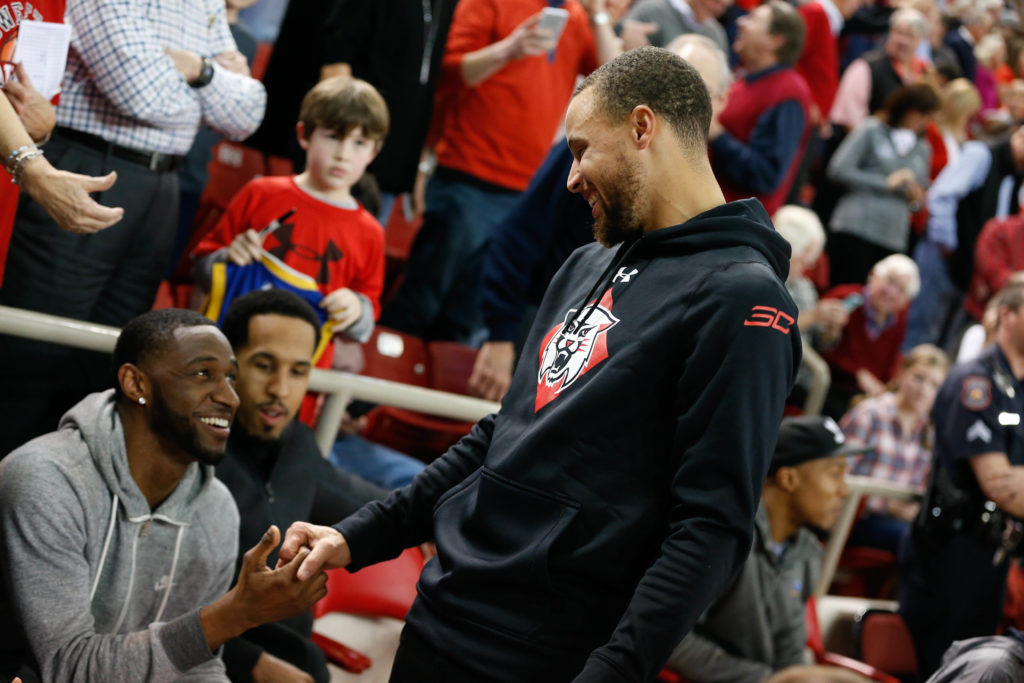 Steph Curry shakes hands with his Golden State Warrior teammate Ian Clark Shaun Livingston sits in the background. (Photo: Jeremy Brevard-USA TODAY Sports)