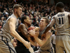 Troy Caupain (10) and Xavier Musketeers guard J.P. Macura (55) battle for a rebound at Fifth Third Arena. The Bearcats won 86-78. (Photo: Sam Greene/The Enquirer via USA TODAY Sports)