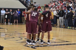 Jason Hawkes (4) hit a 3-pointer in the closing seconds as Aquinas rallied to defeat Williamsville-South (VI), 52-51. (Photo courtesy of Aquinas Institute Athletics)
