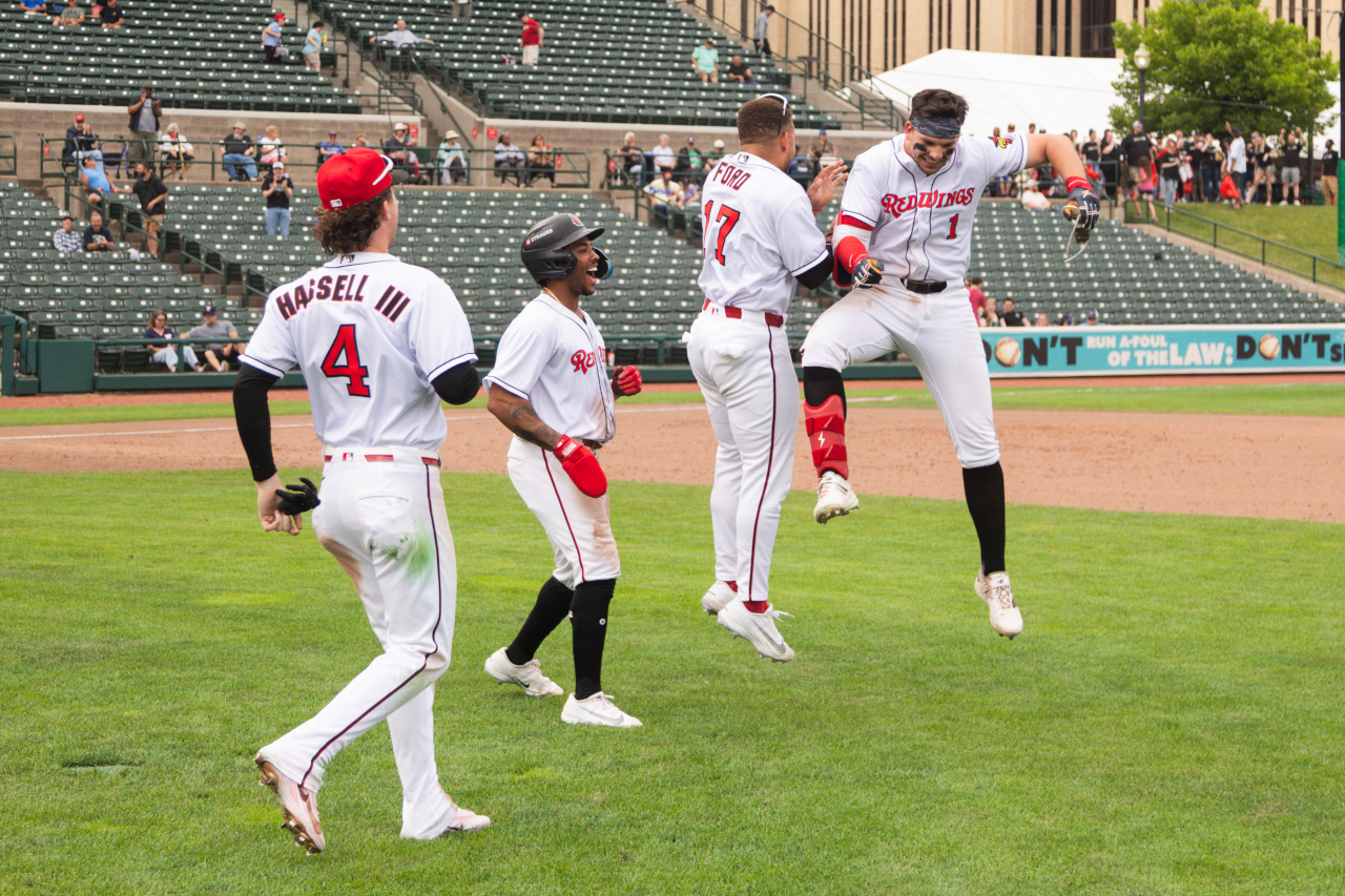 Red Wings win in 11, 6-5, to move back to first with four games left in first half